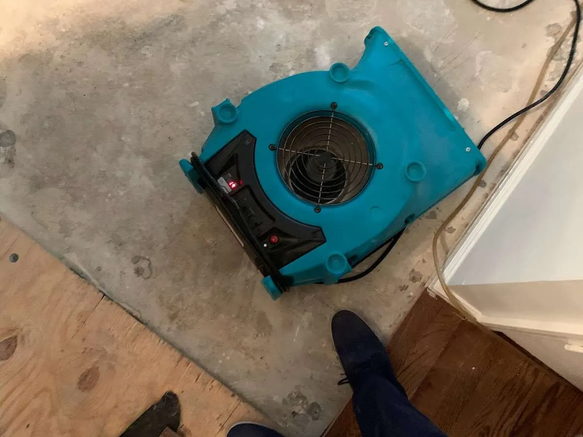 Air mover drying subfloor during Leak Detection & Repair in Valley